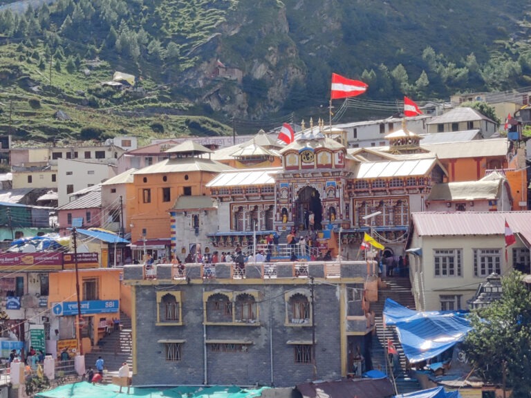 Early morning view of badrinath Temple with Himalayan peaks in the background."