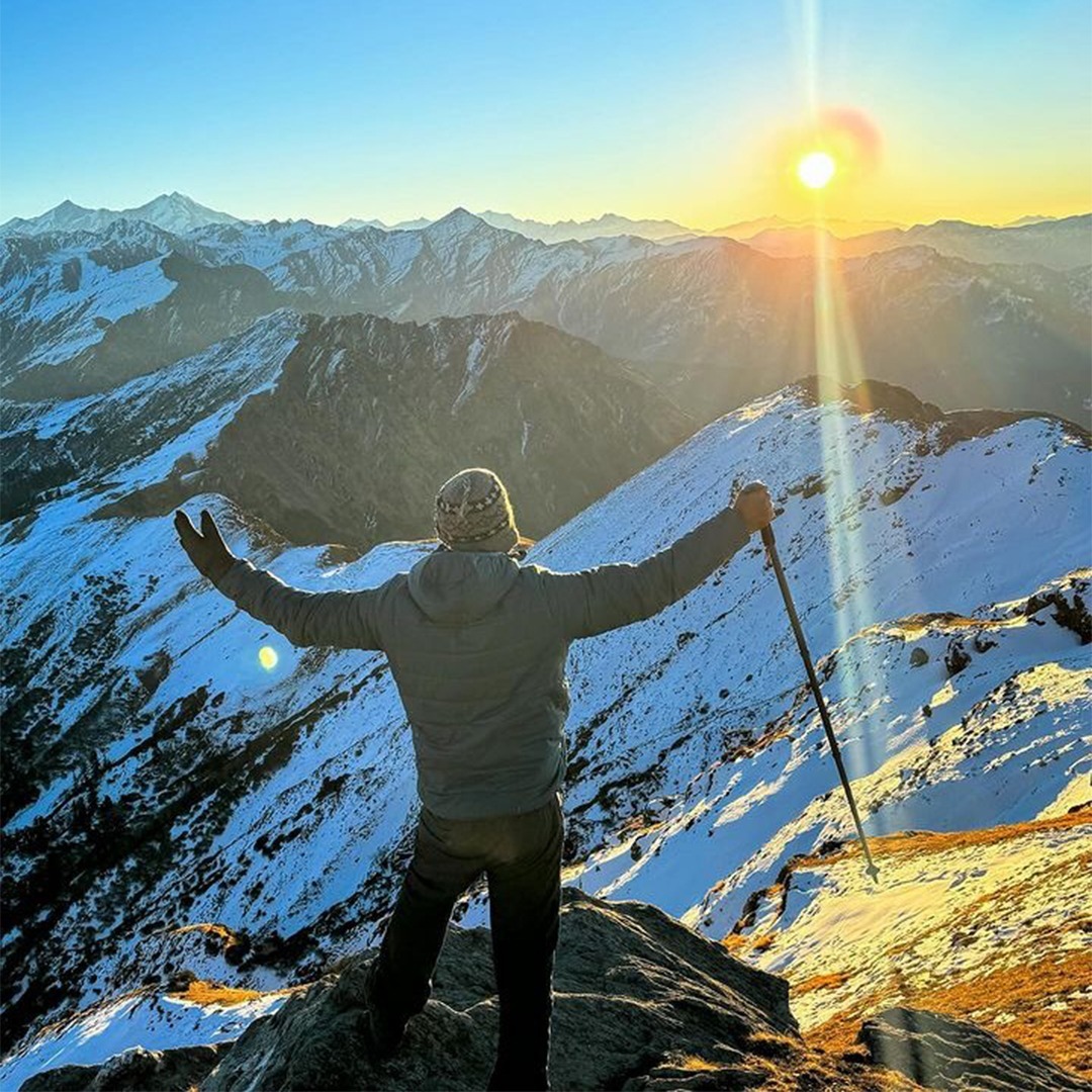 Snow-covered Kedarkantha Summit with panoramic Himalayan mountain views